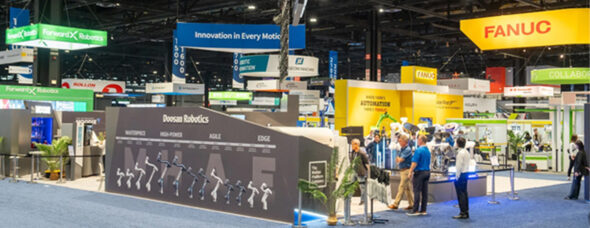 Doosan Robotics trade show booth with modern design and robotic arm displays under bold overhead signage.