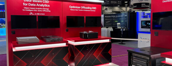 Custom red trade show booth with LED lighting and product displays