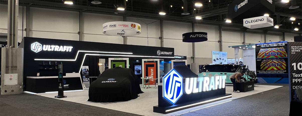 double deck trade show booth with overhead signage