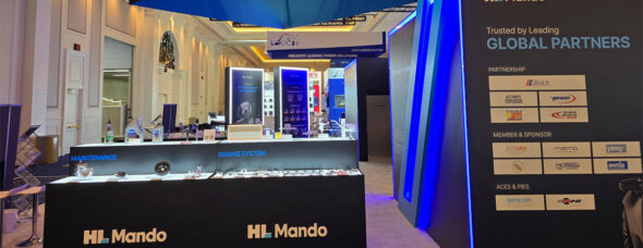 Custom trade show booth with product showcase counters and LED accent lighting