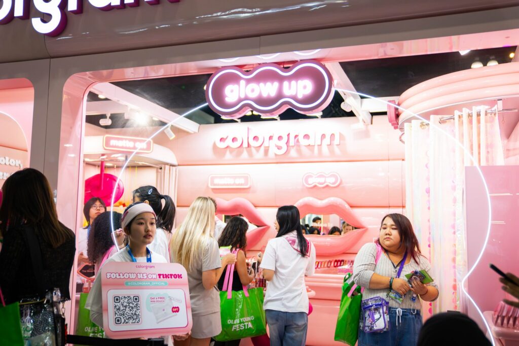 Colorgram Glow Up booth with pink neon signage and lips-shaped photo op at Olive Young Festa