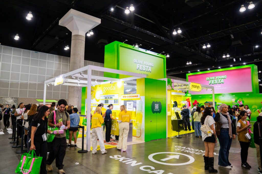 Gangnam Street skincare zone with Goodal and Manyo brand booths and floor wayfinding graphics at Olive Young Festa