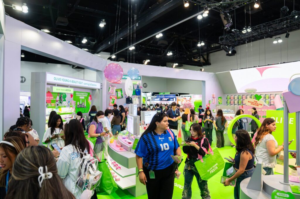 Olive Young K-Beauty Edit store interior with green floor and product displays at KCON LA 2026