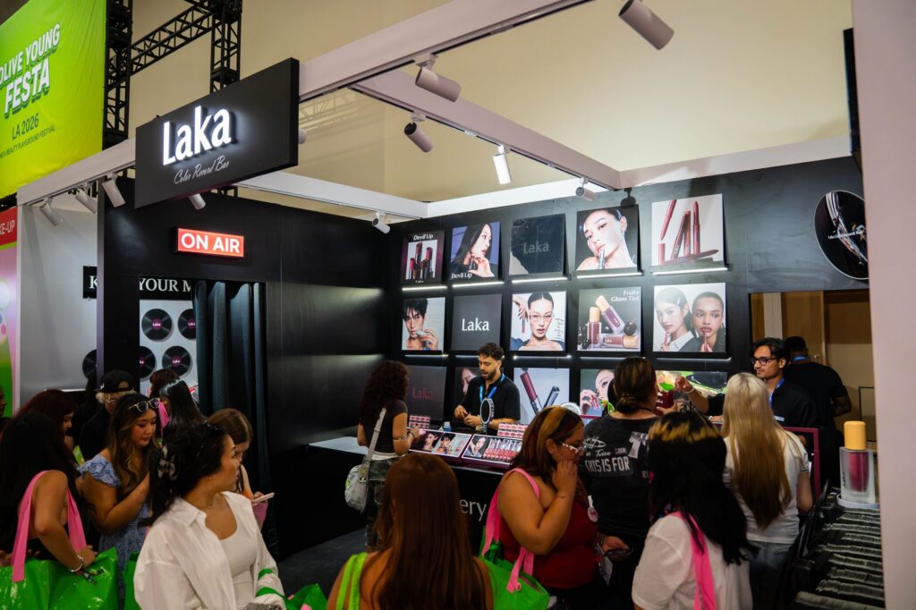 Laka makeup booth with black On Air studio design and campaign photo wall at Olive Young Festa