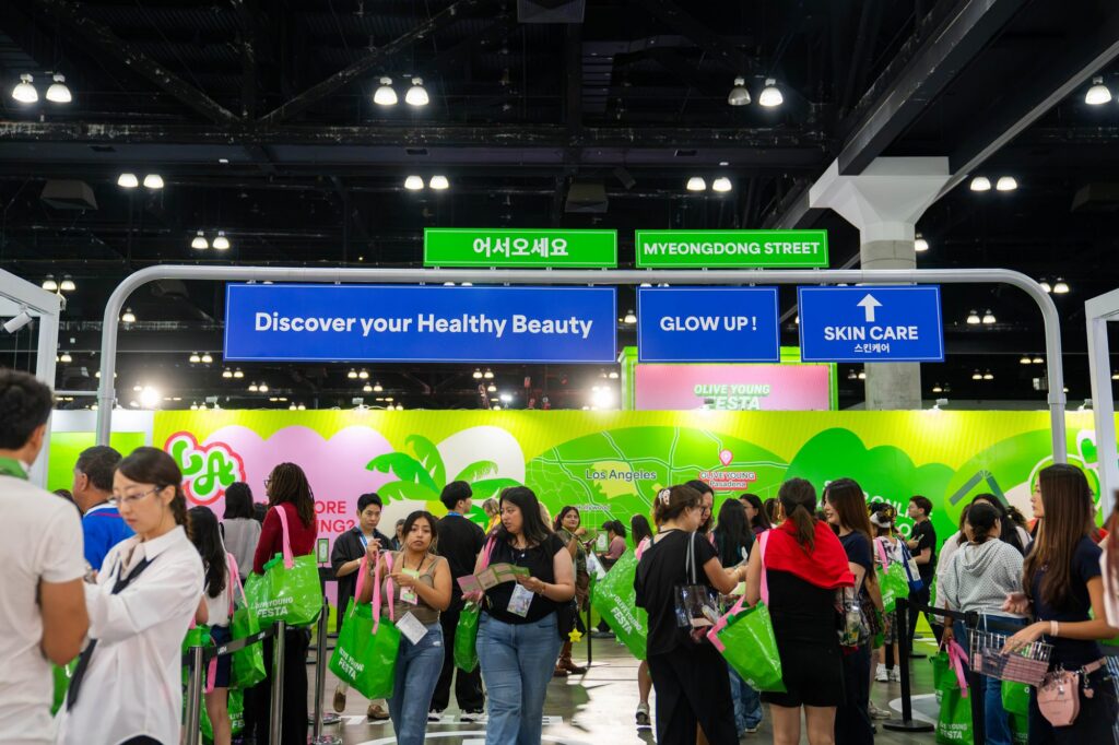 Discover Your Healthy Beauty wayfinding gantry with Korean welcome sign on Myeongdong Street at Olive Young Festa