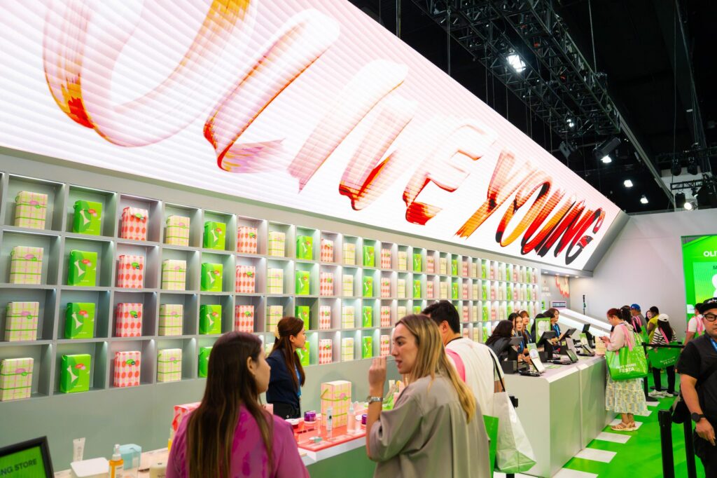 Olive Young flagship store with LED ribbon sign above checkout counters at Olive Young Festa LA 2026