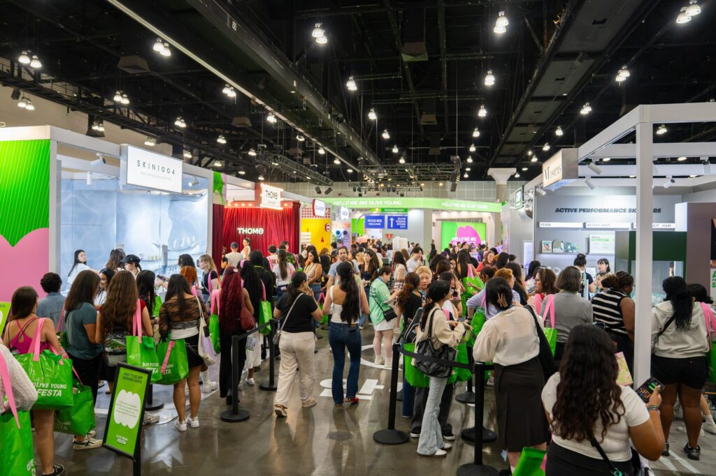 Crowd of attendees near the THOME booth in the Olive Young Festa skincare zone
