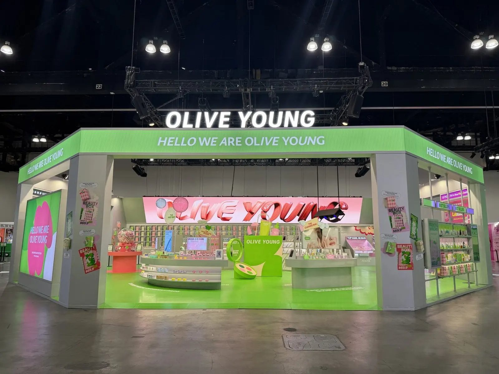 Olive Young main booth with green fascia and LED wall at KCON LA 2026