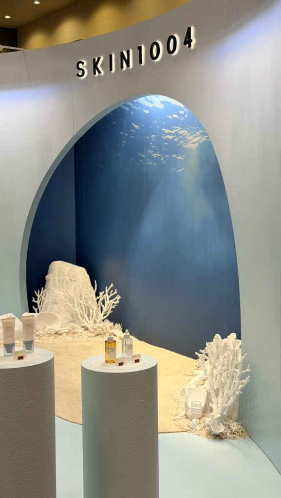 SKIN1004 dimensional lettering above the arched ocean dome graphic