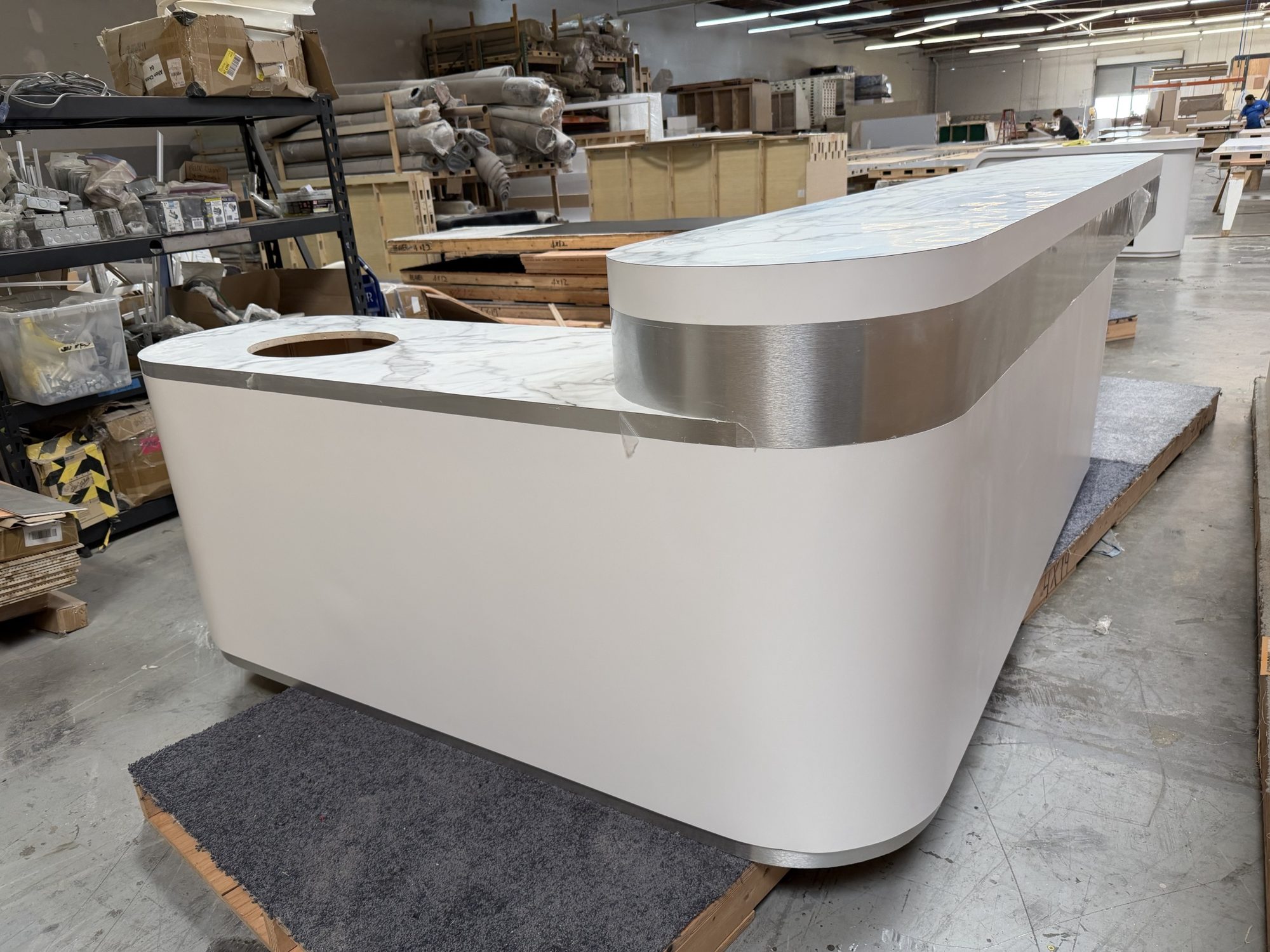 Demo counter with brushed aluminum trim and built-in sink cutout