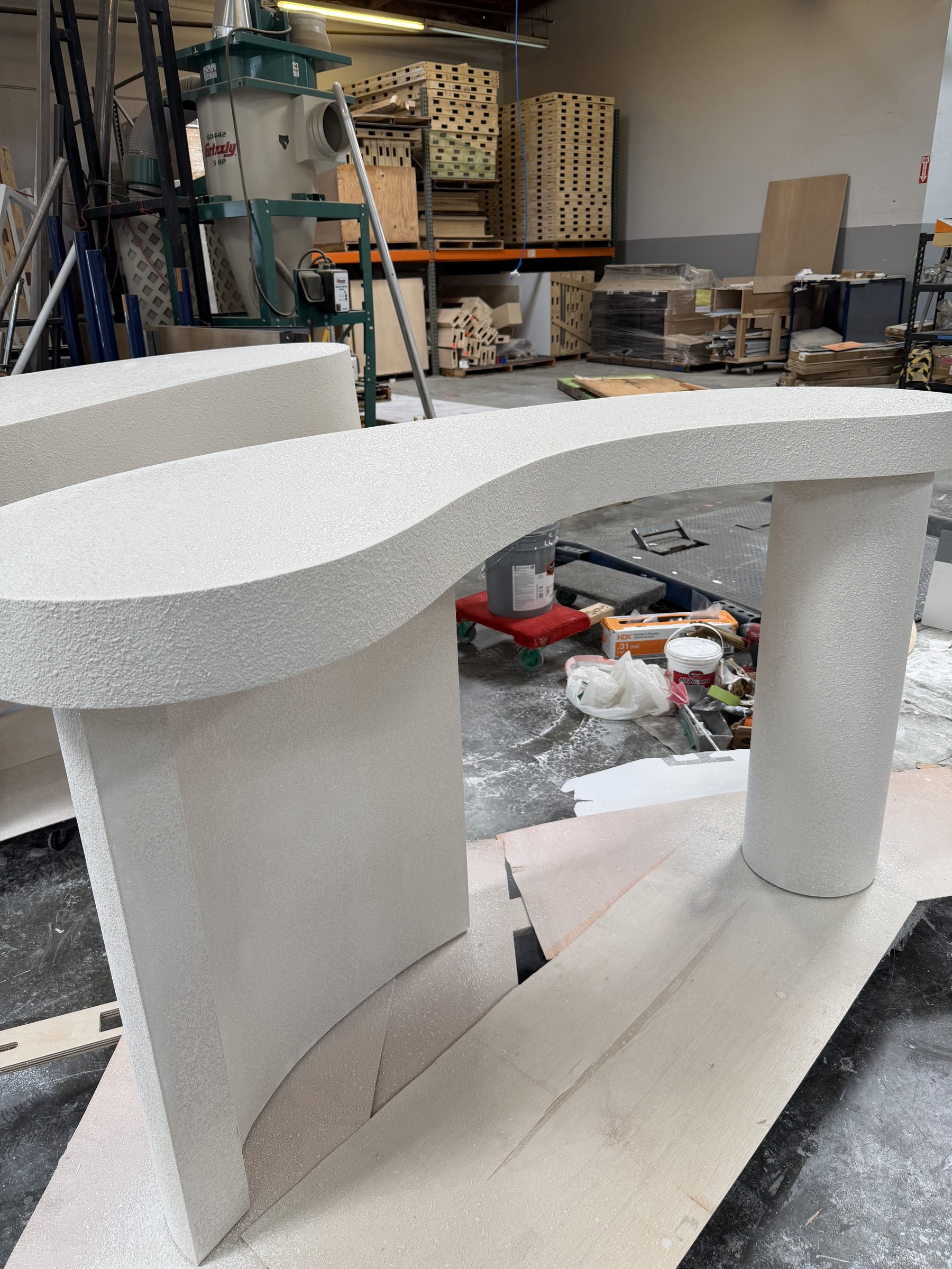 Stucco texture on an S-curve table top and legs