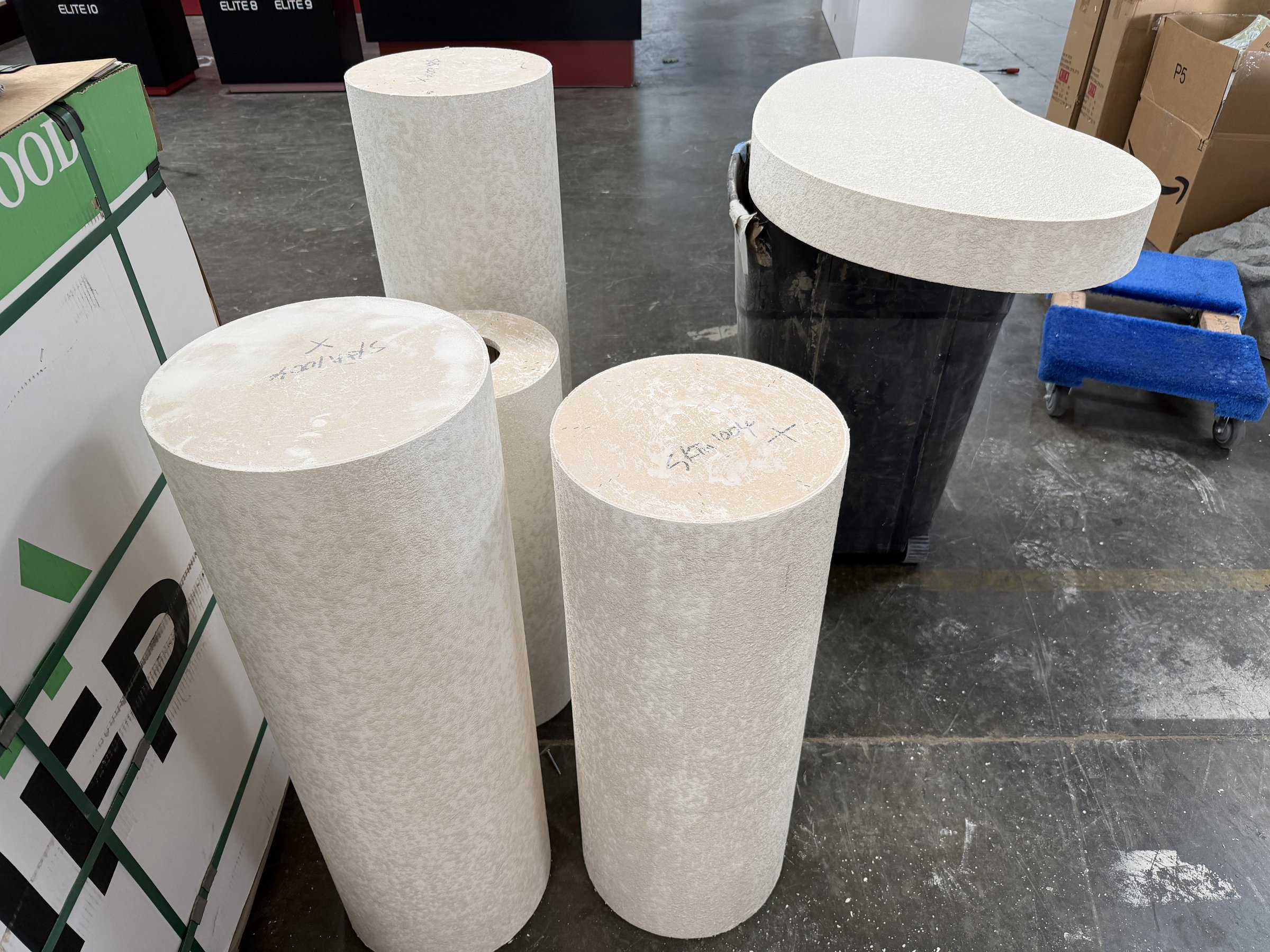 Stucco-coated column pedestals and table top before paint
