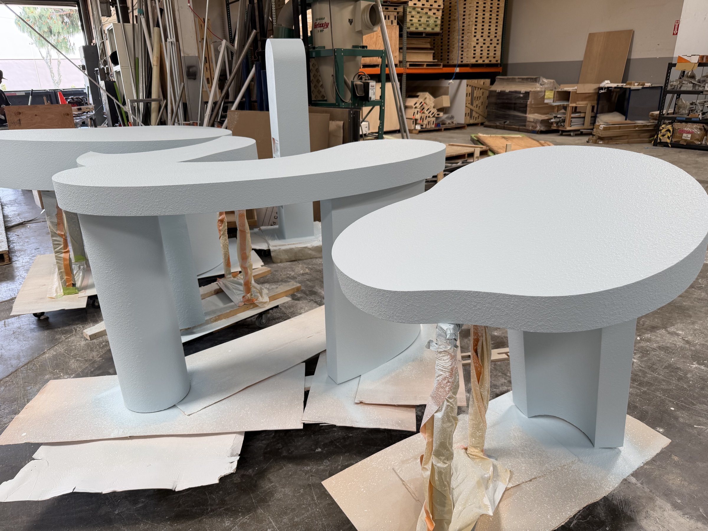 Booth furniture painted in pale blue over stucco texture