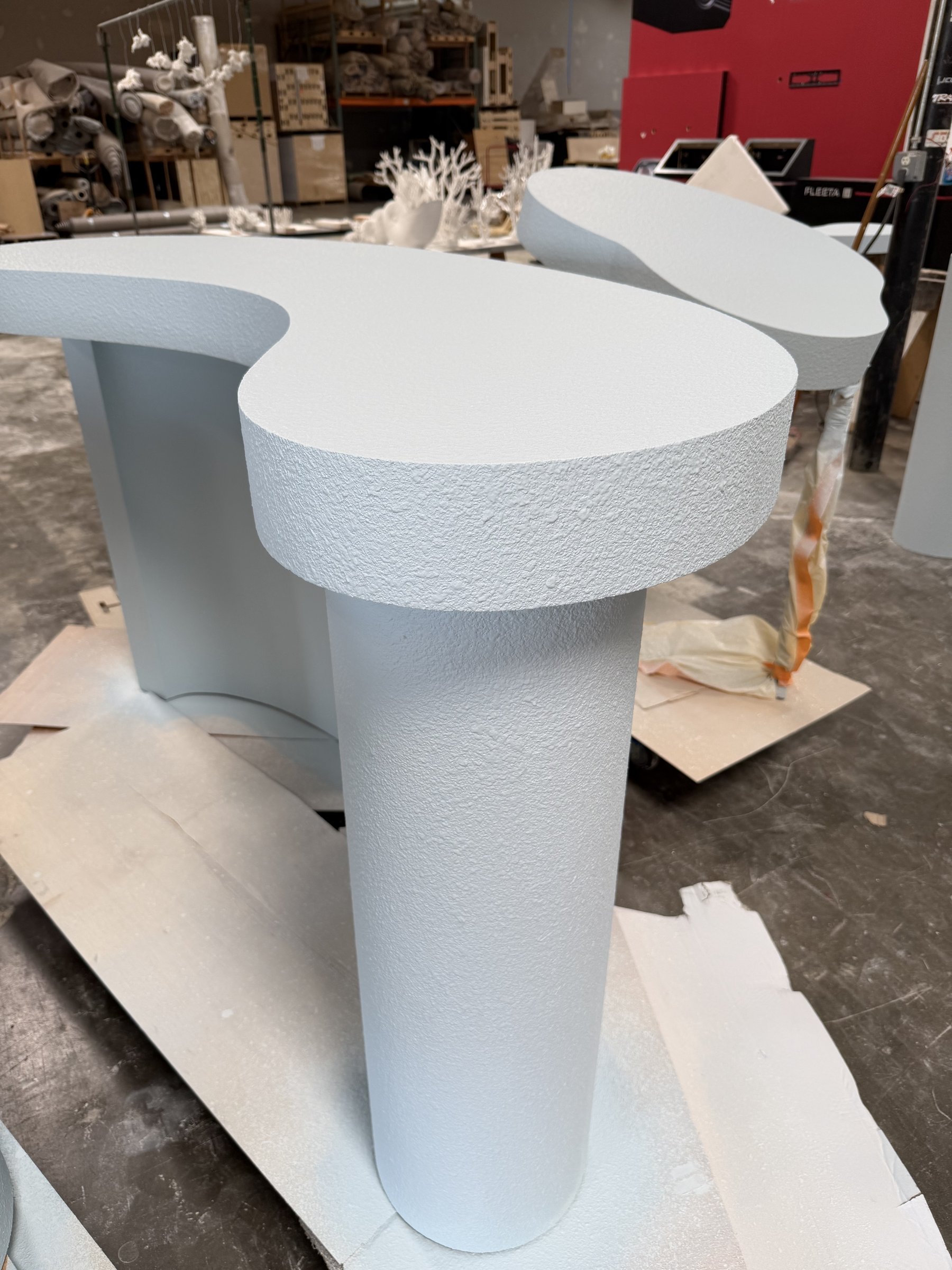 Close-up of painted stucco texture on a column-leg table