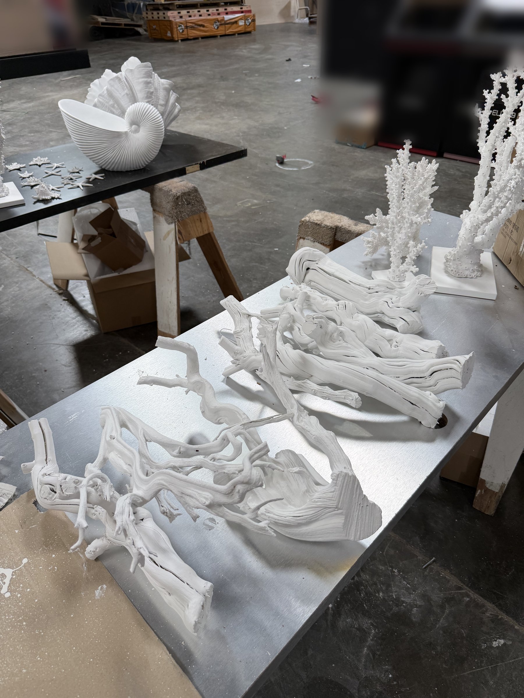 Driftwood props primed and painted white for the SKIN1004 booth