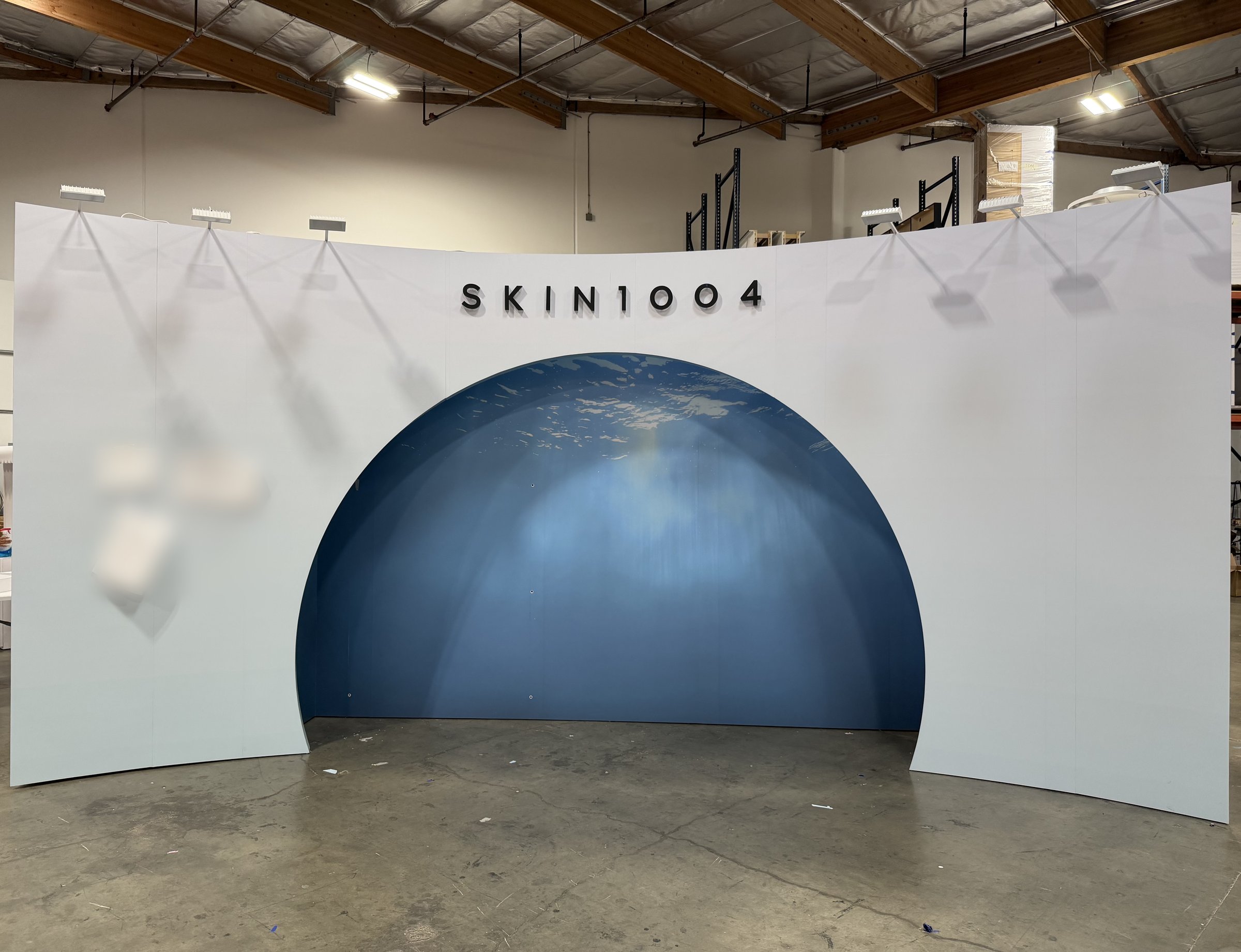Full pre-setup of the SKIN1004 dome wall with lettering and arm lights